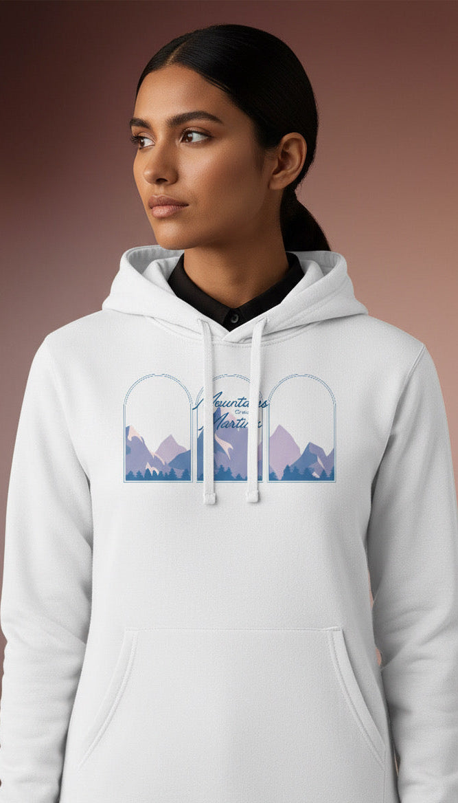 Person wearing a white Mountains over Martinis hoodie on a brown background